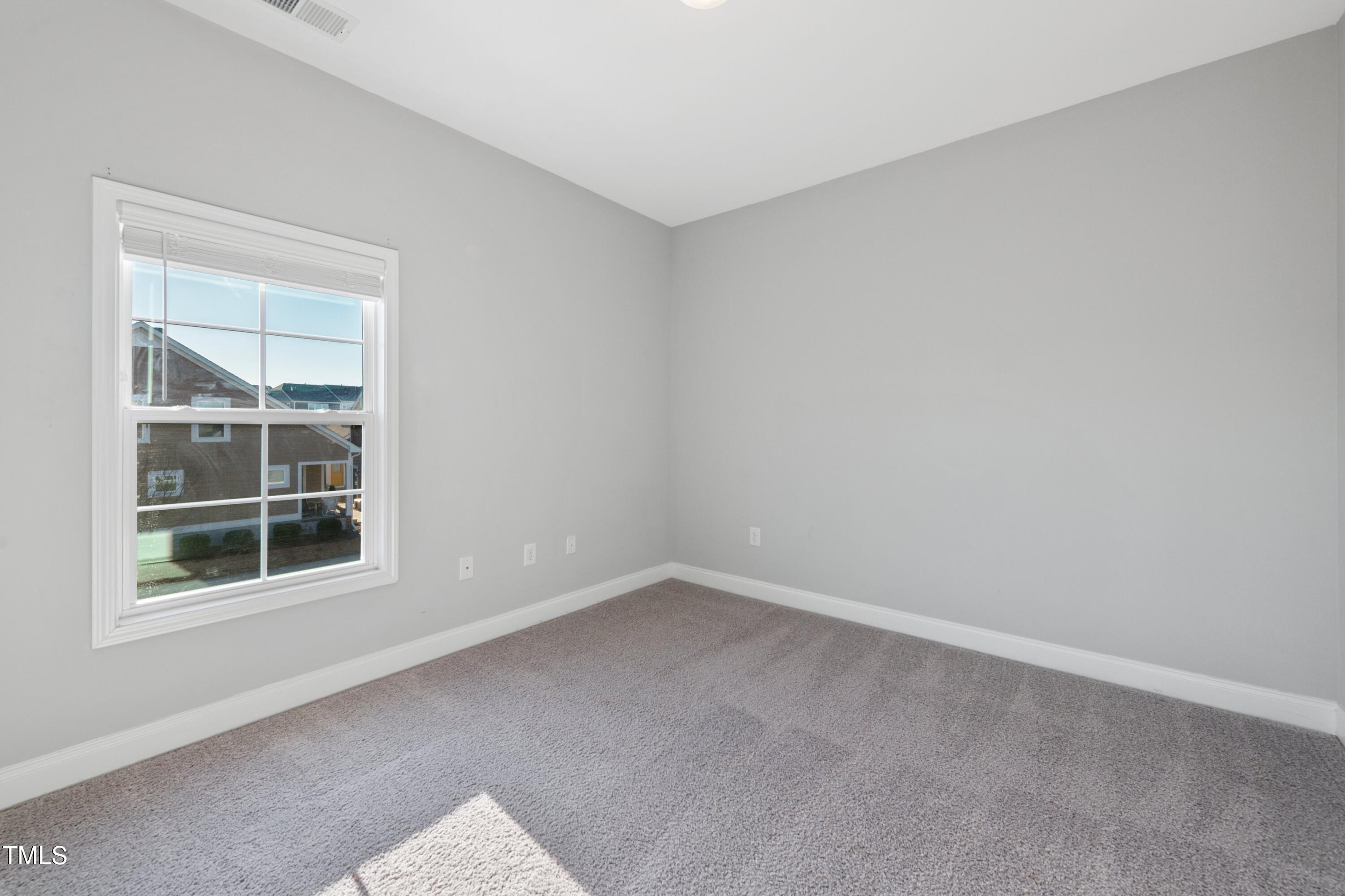5501 Advancing Avenue Raleigh, NC 27616 - Photo 45 of 56 Second bedroom looks out over pocket park