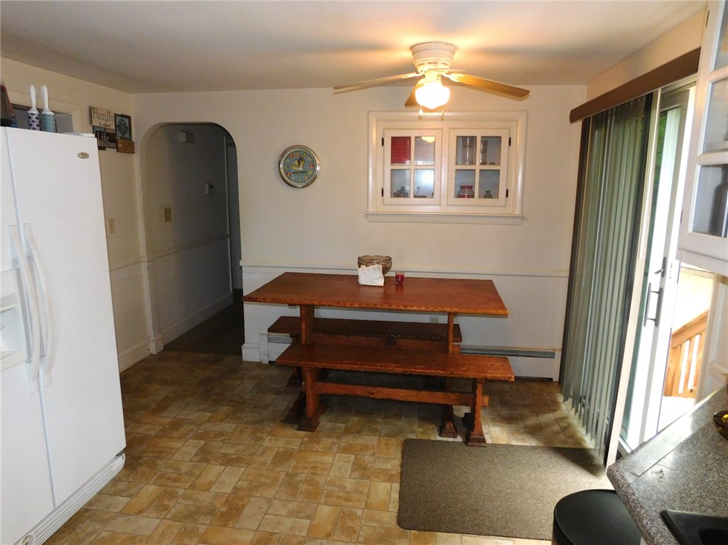 4 Mellon Road Warwick, RI 02889 - Photo 5 of 15 Dining area with a slider to a 12 ft deck overlooking a Hugh fenced yard.