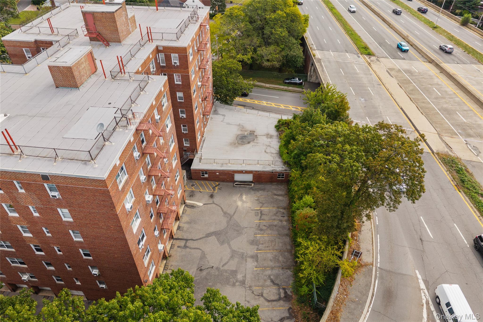 1234 Midland Avenue, Unit 3F Bronxville, NY 10708 - Photo 21 of 23 an aerial view of a house with a yard and potted plants