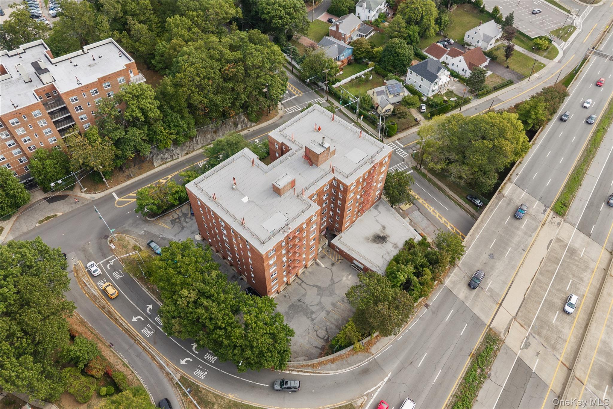 1234 Midland Avenue, Unit 3F Bronxville, NY 10708 - Photo 22 of 23 an aerial view of a house with a garden