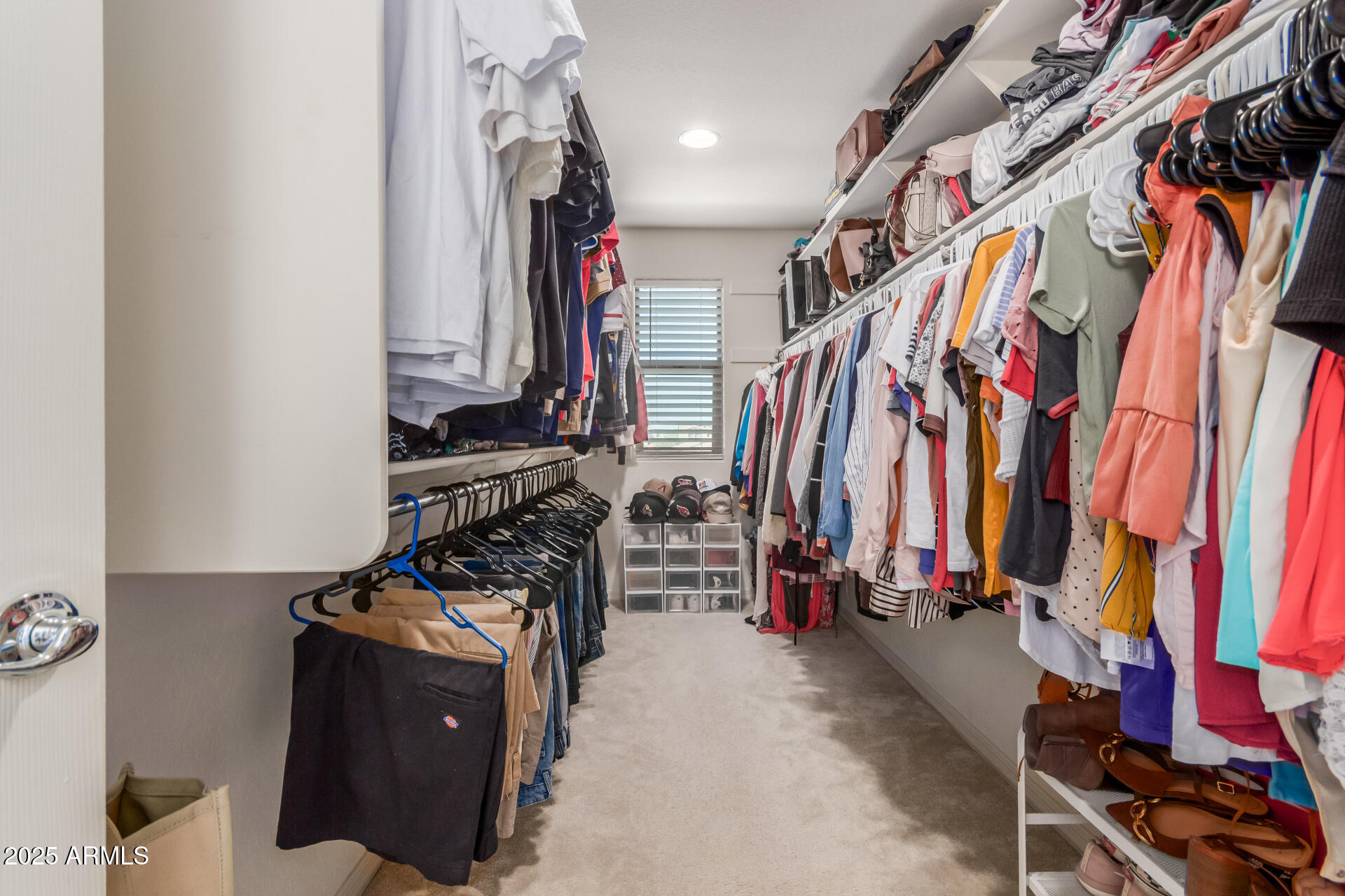 3215 West Pollack Street Phoenix, AZ 85041 - Photo 11 of 26 a view of walk in closet with clothes