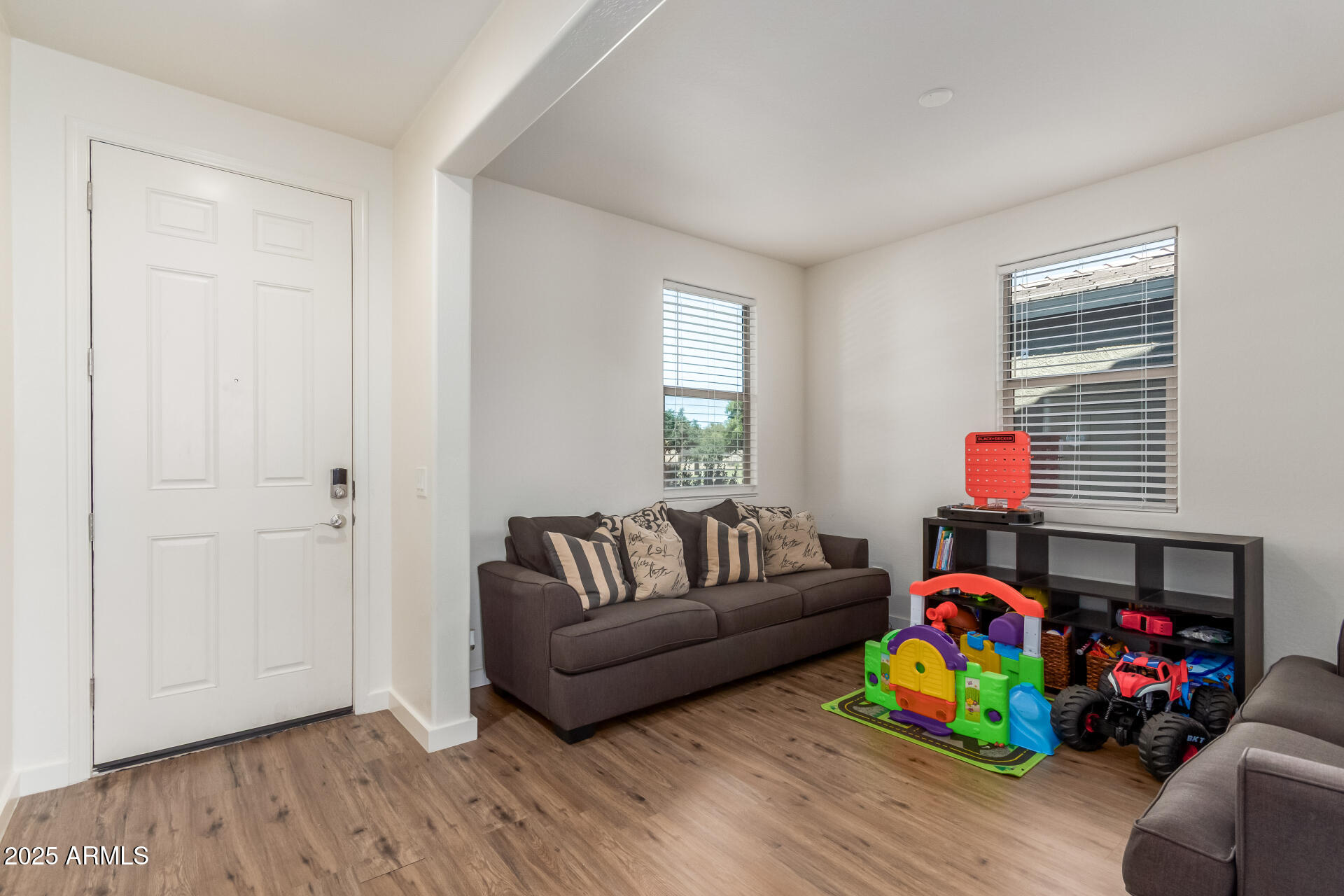 3215 West Pollack Street Phoenix, AZ 85041 - Photo 2 of 26 a living room with furniture and a wooden floor