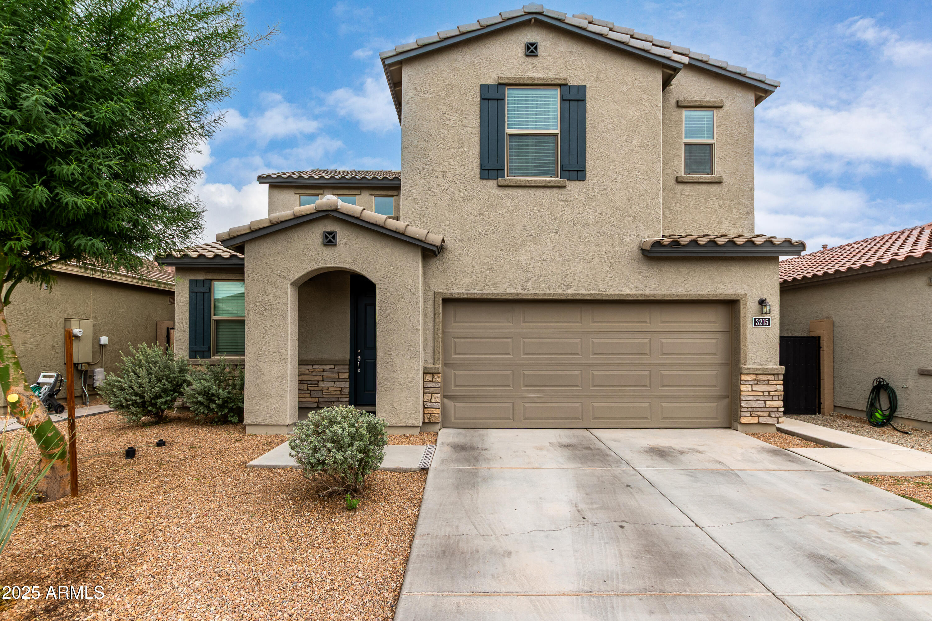3215 West Pollack Street Phoenix, AZ 85041 - Photo 22 of 26 a front view of a house with garden