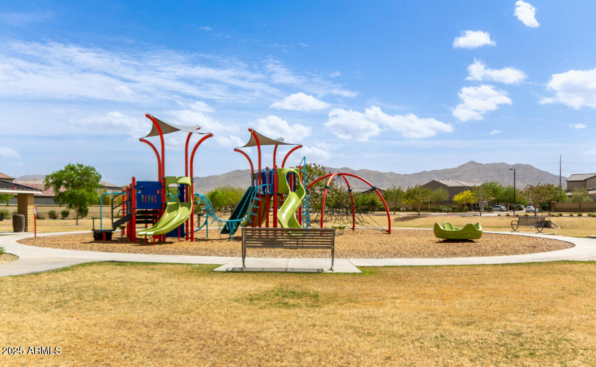 3215 West Pollack Street Phoenix, AZ 85041 - Photo 25 of 26 a view of a swimming pool with a yard