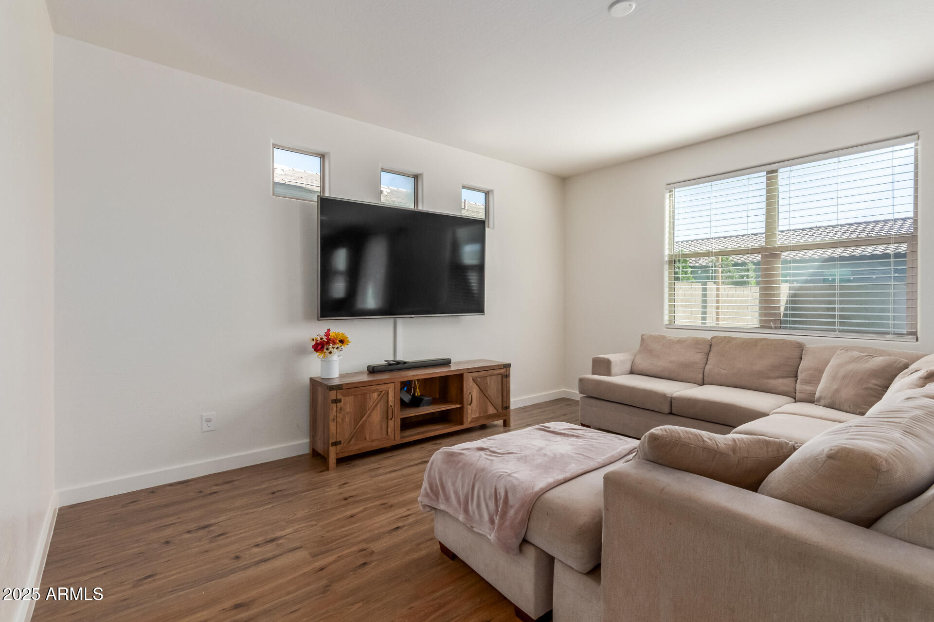 3215 West Pollack Street Phoenix, AZ 85041 - Photo 3 of 26 a living room with furniture and a flat screen tv