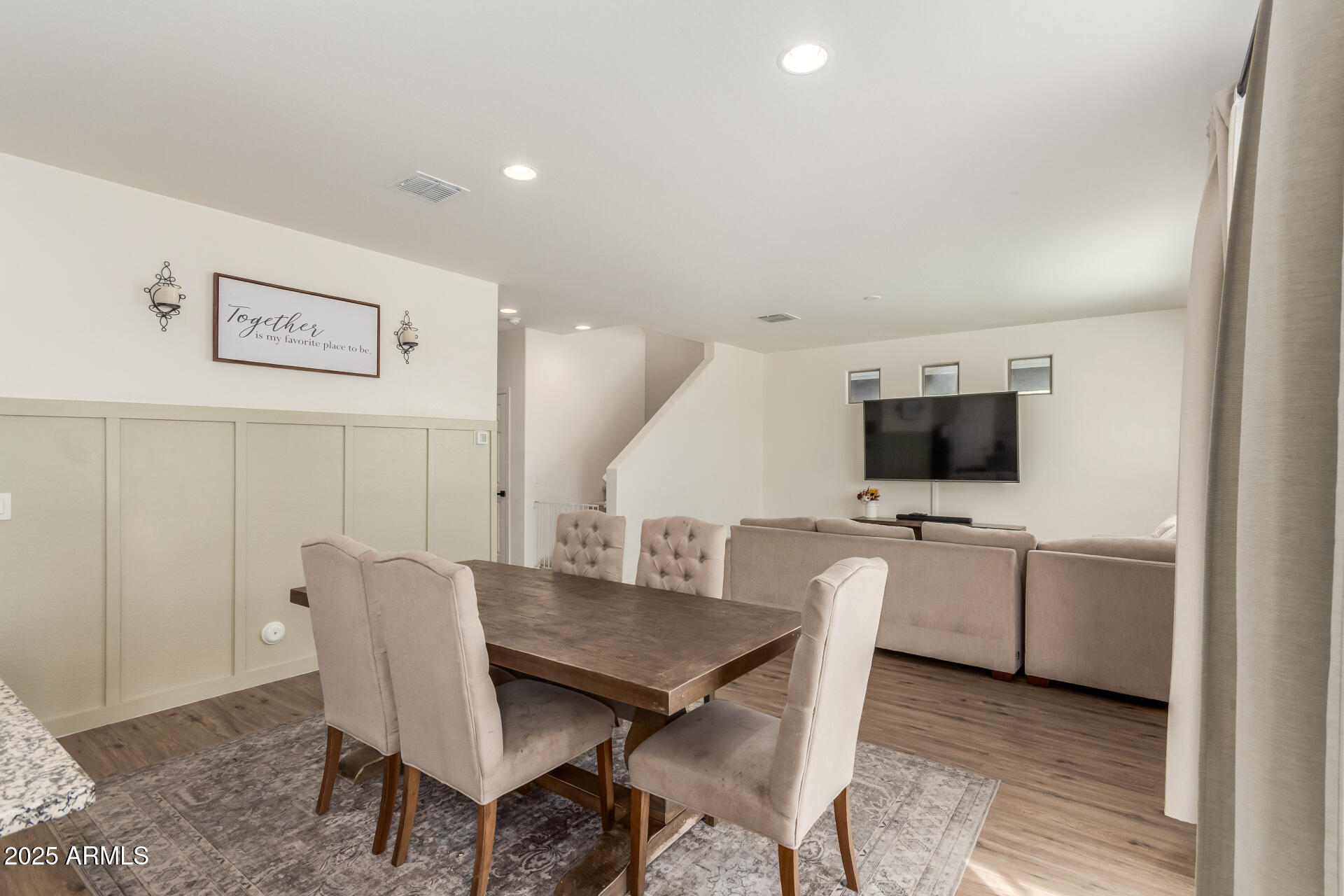 3215 West Pollack Street Phoenix, AZ 85041 - Photo 4 of 26 a view of a dining room with furniture and wooden floor
