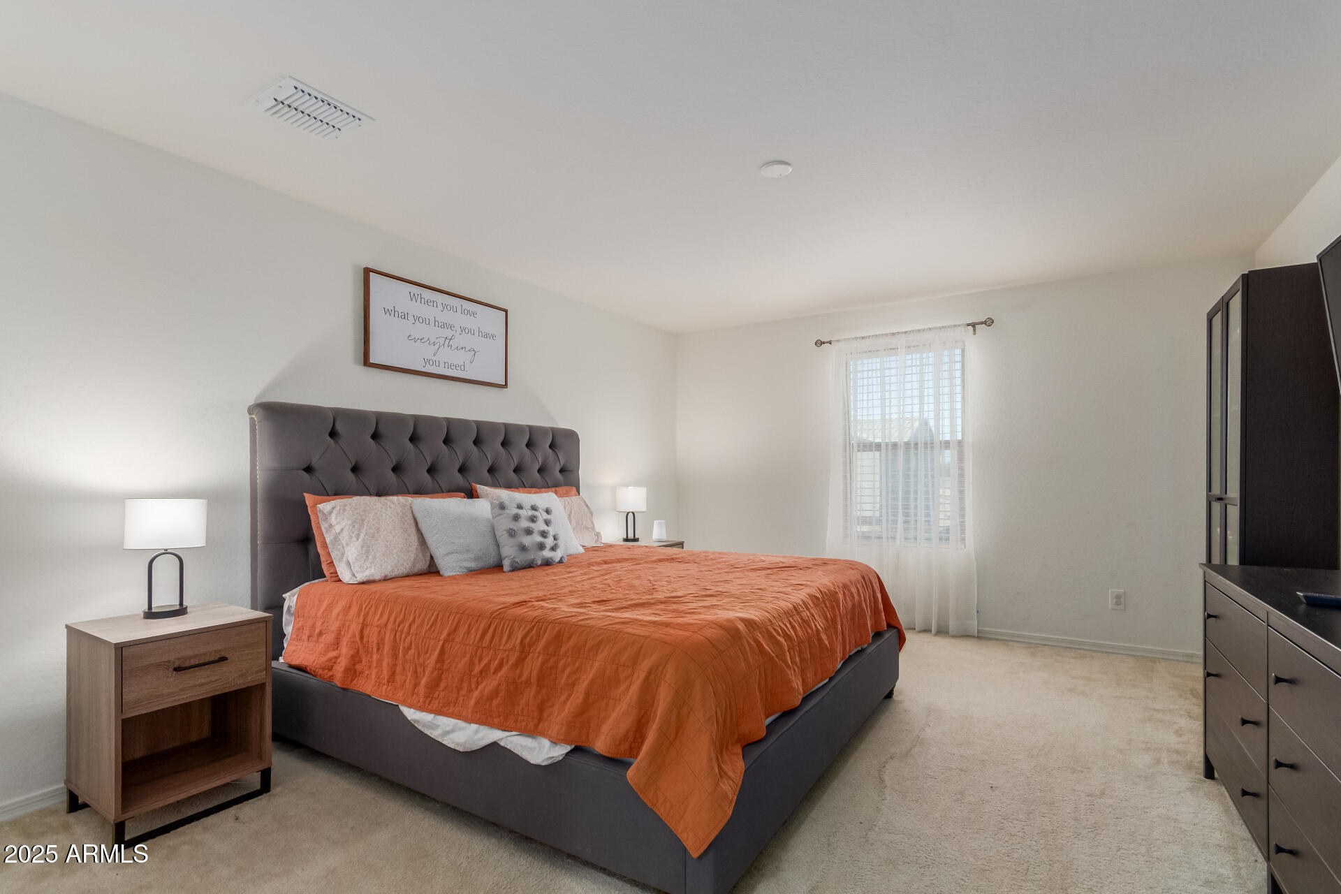 3215 West Pollack Street Phoenix, AZ 85041 - Photo 9 of 26 a bedroom with a bed and a flat screen tv