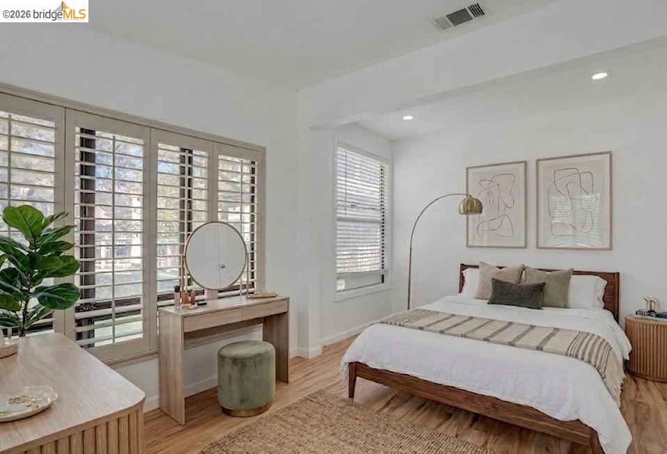 1922 Taylor Road Bethel Island, CA 94511 - Photo 15 of 49 a bedroom with a bed and wooden floor