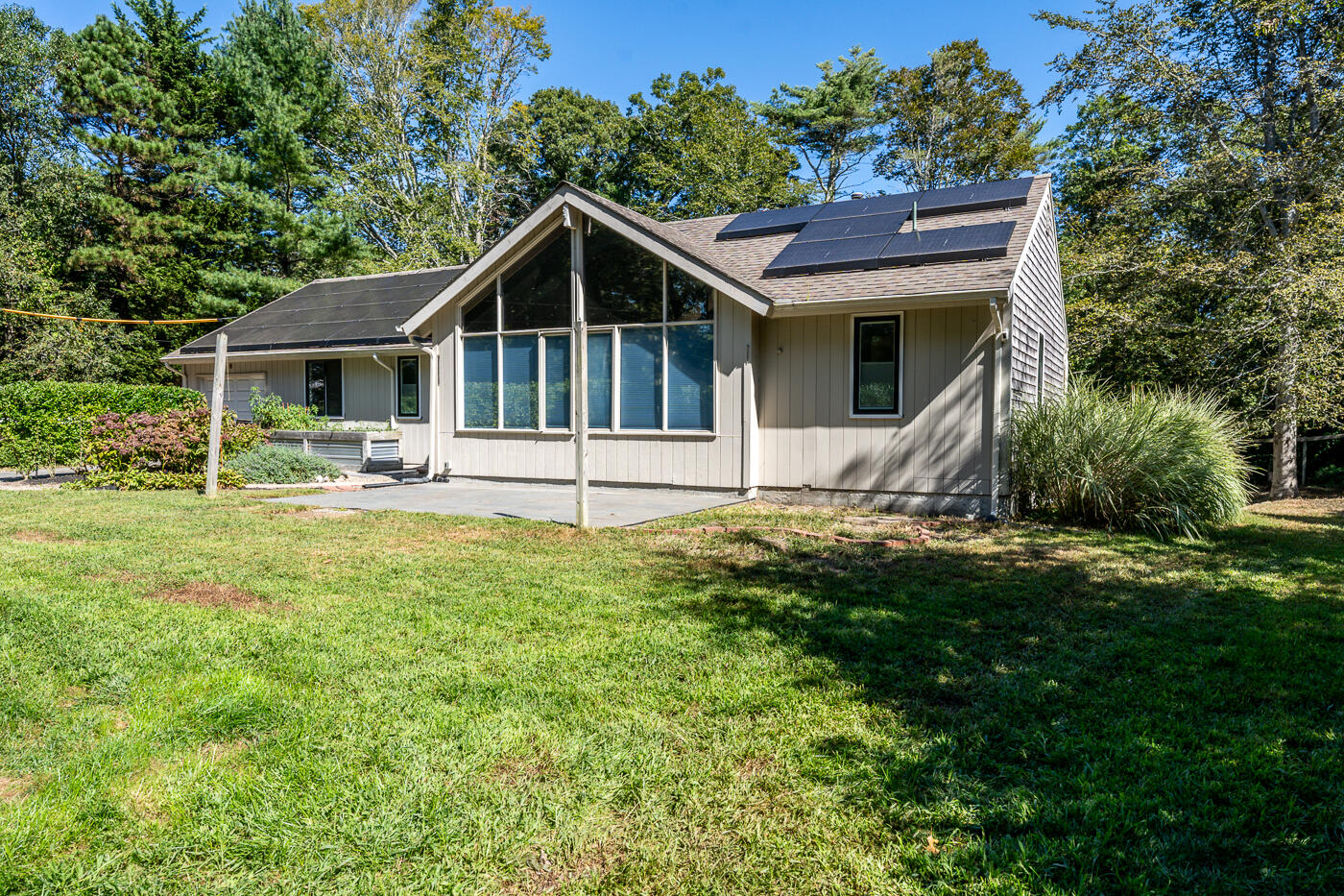 57 Holly Point Road Centerville, MA 02632 - Photo 2 of 41 a front view of house with yard and green space