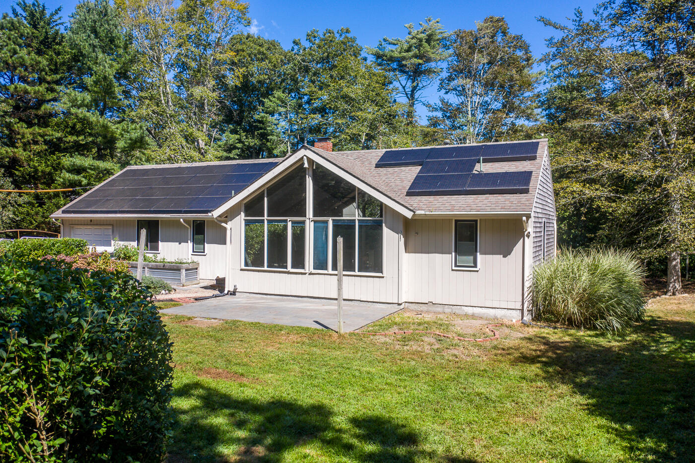 57 Holly Point Road Centerville, MA 02632 - Photo 41 of 41 a house that has a big yard plants and large trees