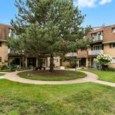 a front view of a house with swimming pool having outdoor seating