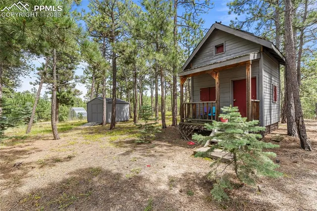 a view of a park with iron fence