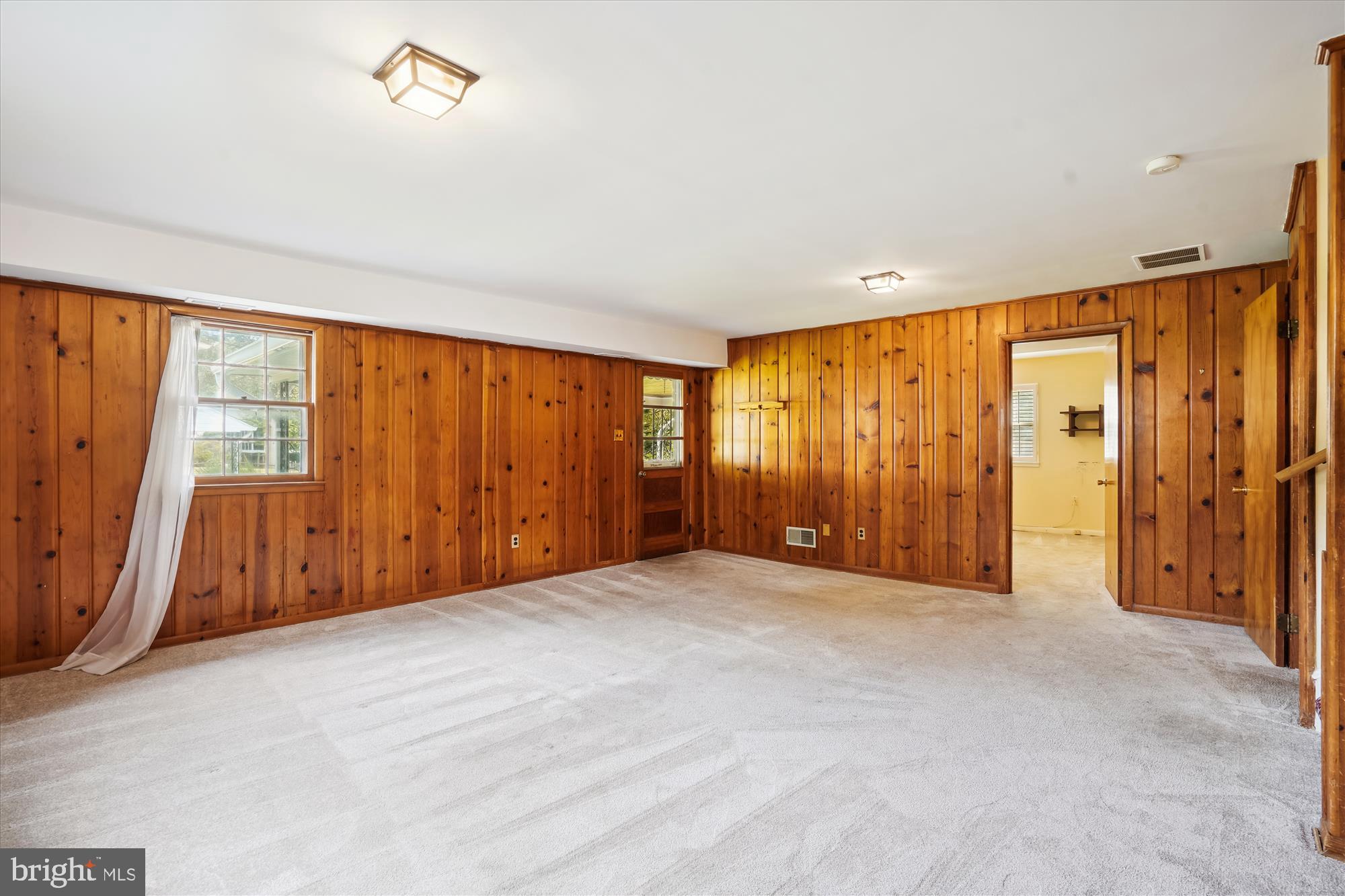 7107 Purdue Place McLean, VA 22101 - Photo 35 of 78 Wood Paneling and Door to the Carport