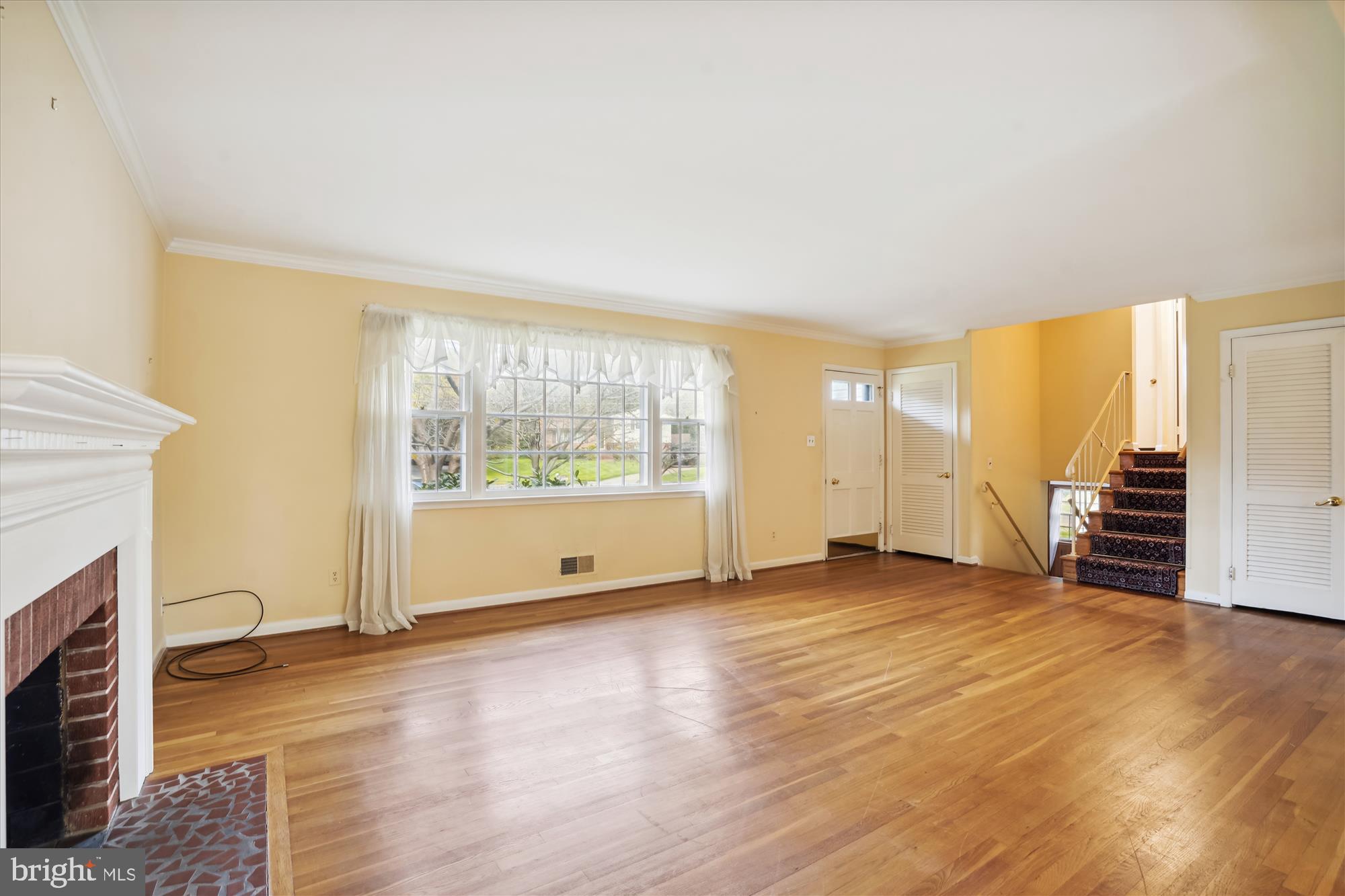 7107 Purdue Place McLean, VA 22101 - Photo 10 of 78 Picture Window and Crown Molding in Living Room