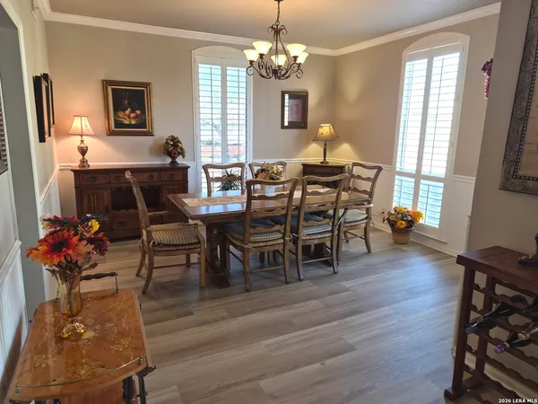 a kitchen with cabinets stainless steel appliances and a refrigerator