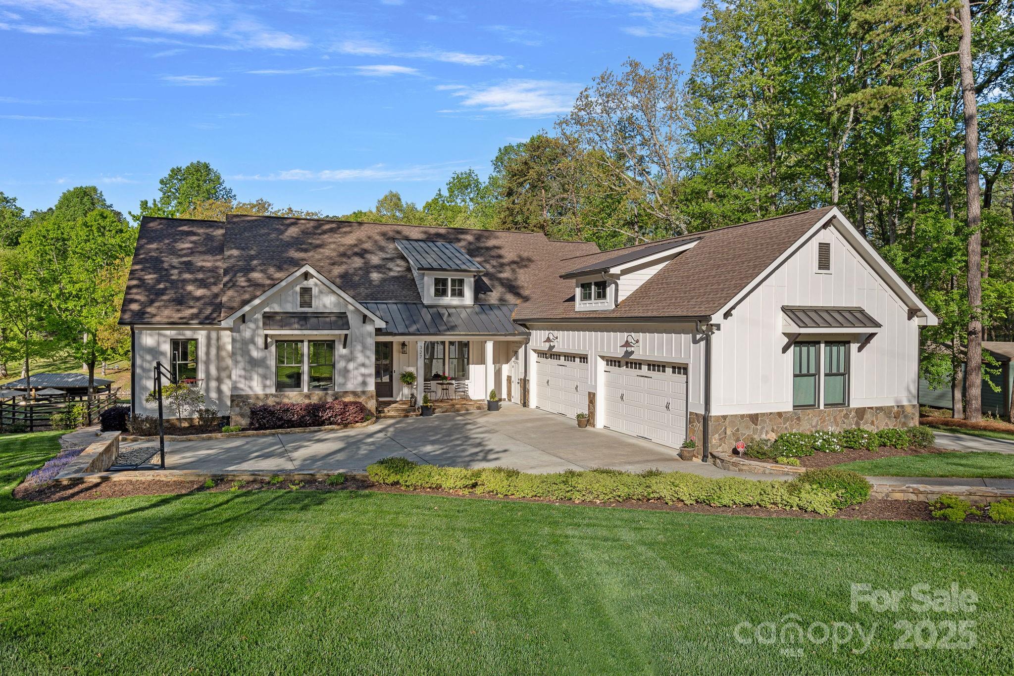 a front view of a house with a garden