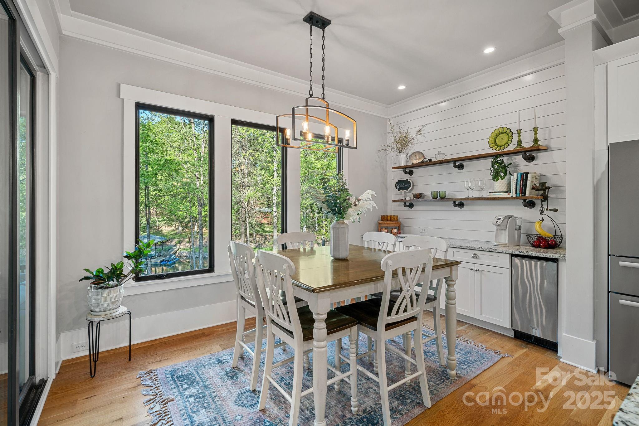 327 Kenway Loop Mooresville, NC 28117 - Photo 13 of 46 a dining room with furniture window wooden floor