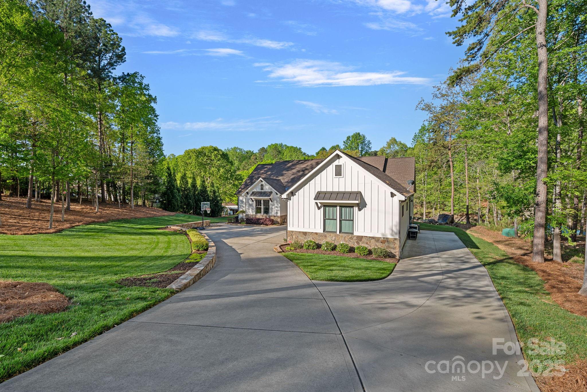 327 Kenway Loop Mooresville, NC 28117 - Photo 2 of 46 a view of a house with a yard