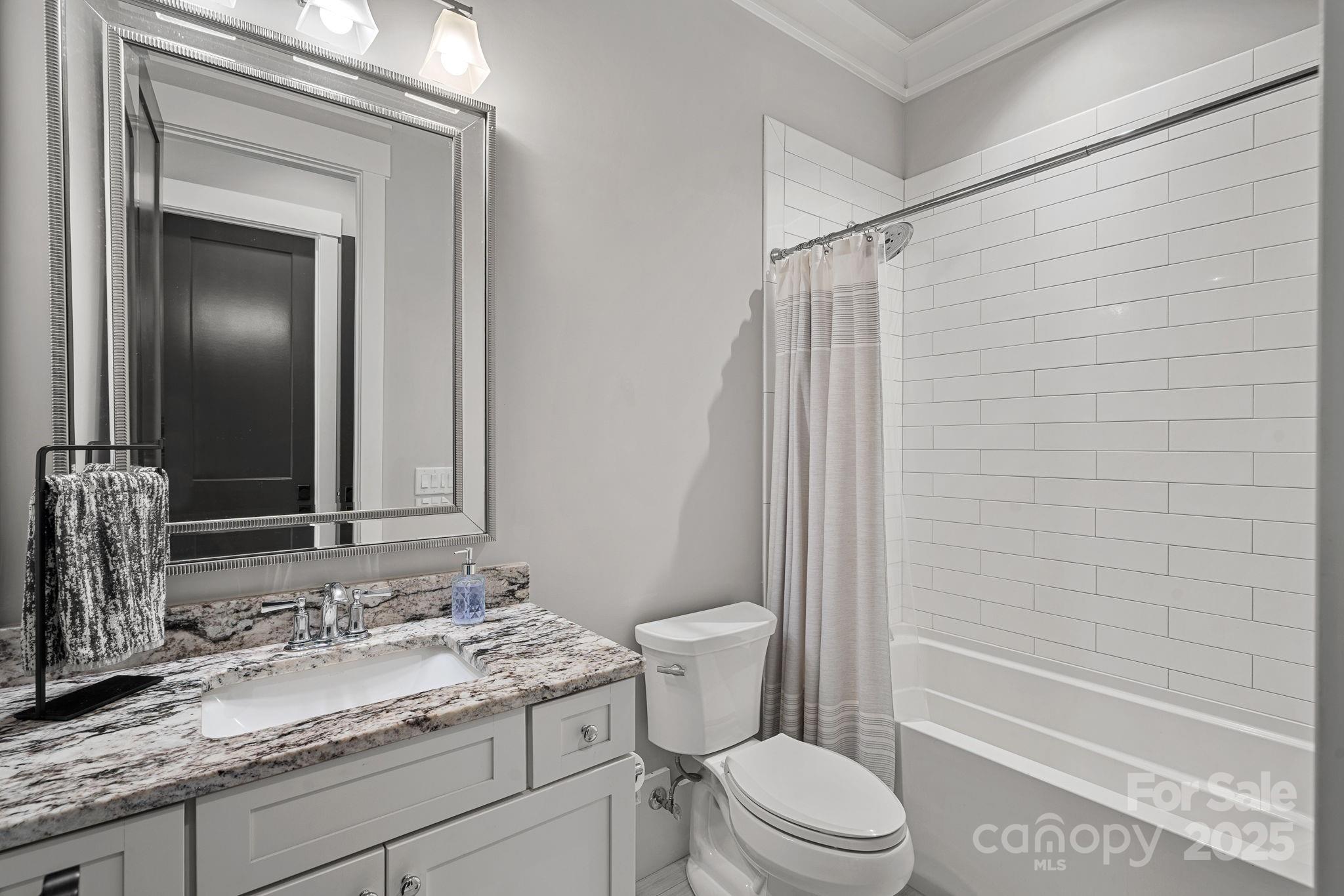 327 Kenway Loop Mooresville, NC 28117 - Photo 21 of 46 a bathroom with a granite countertop sink toilet and shower