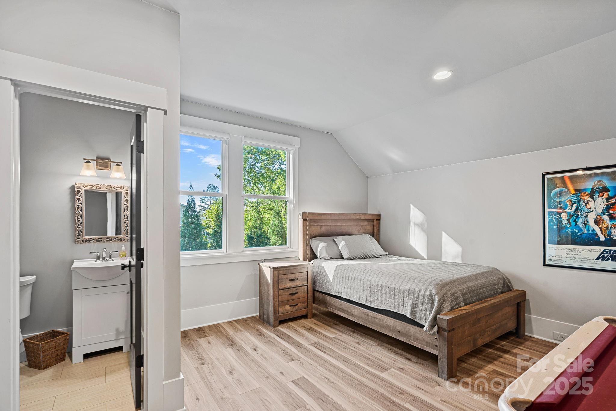 327 Kenway Loop Mooresville, NC 28117 - Photo 28 of 46 a bedroom with a bed and a painting on the wall