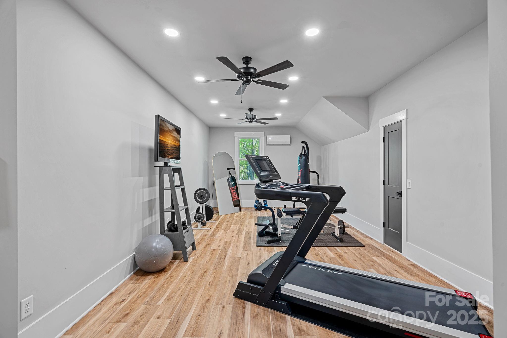 327 Kenway Loop Mooresville, NC 28117 - Photo 30 of 46 a view of a room with gym equipment