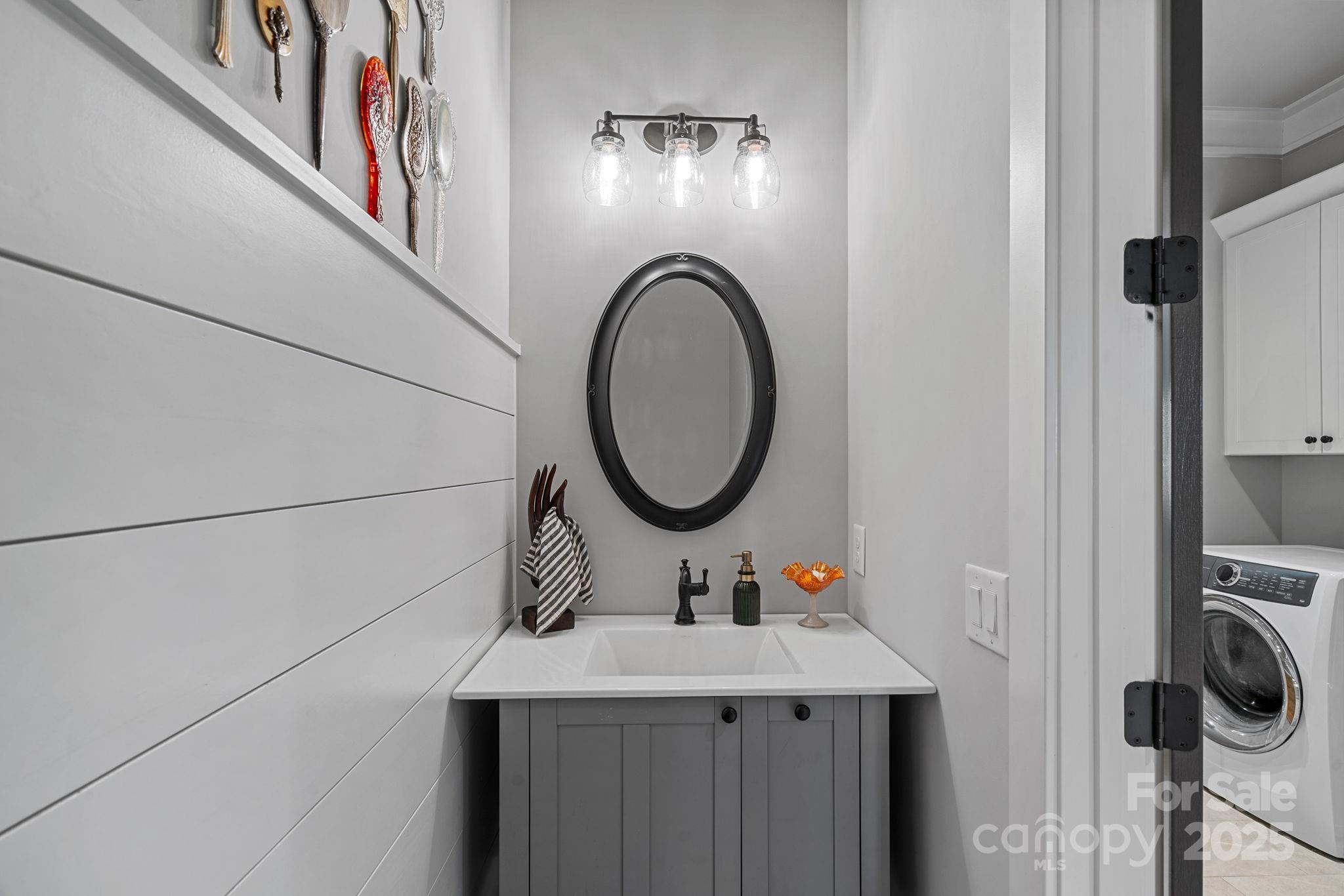 327 Kenway Loop Mooresville, NC 28117 - Photo 33 of 46 a bathroom with a sink and a mirror
