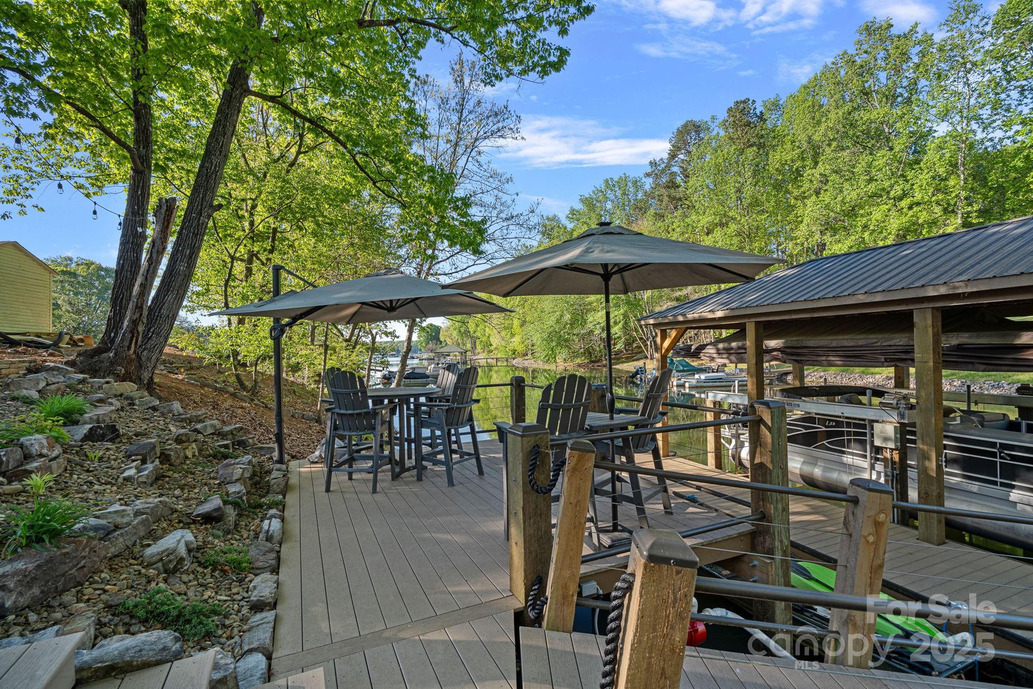 327 Kenway Loop Mooresville, NC 28117 - Photo 39 of 46 an outdoor space with seating area and trees