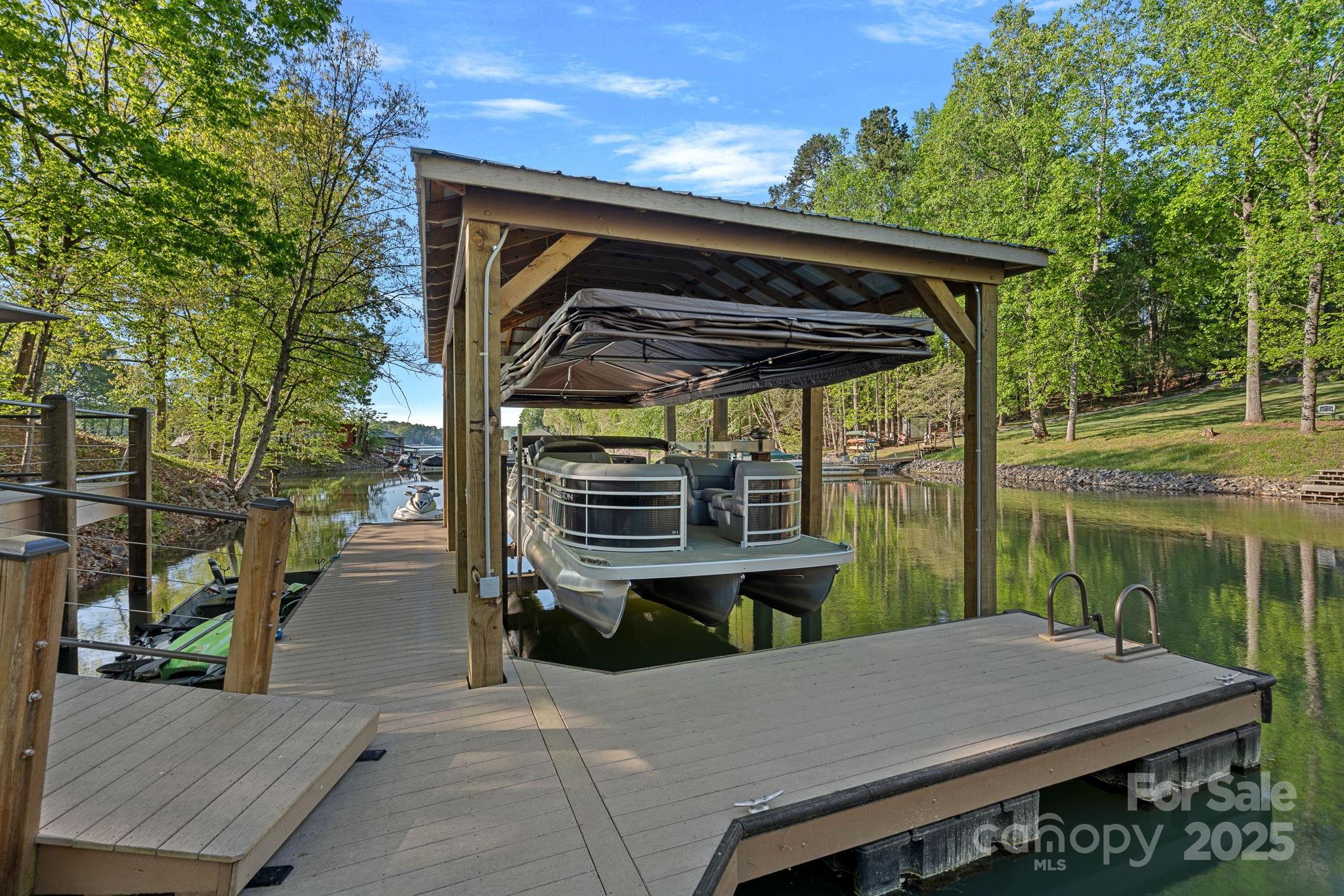 327 Kenway Loop Mooresville, NC 28117 - Photo 40 of 46 a view of a patio with table and chairs with wooden floor and fence