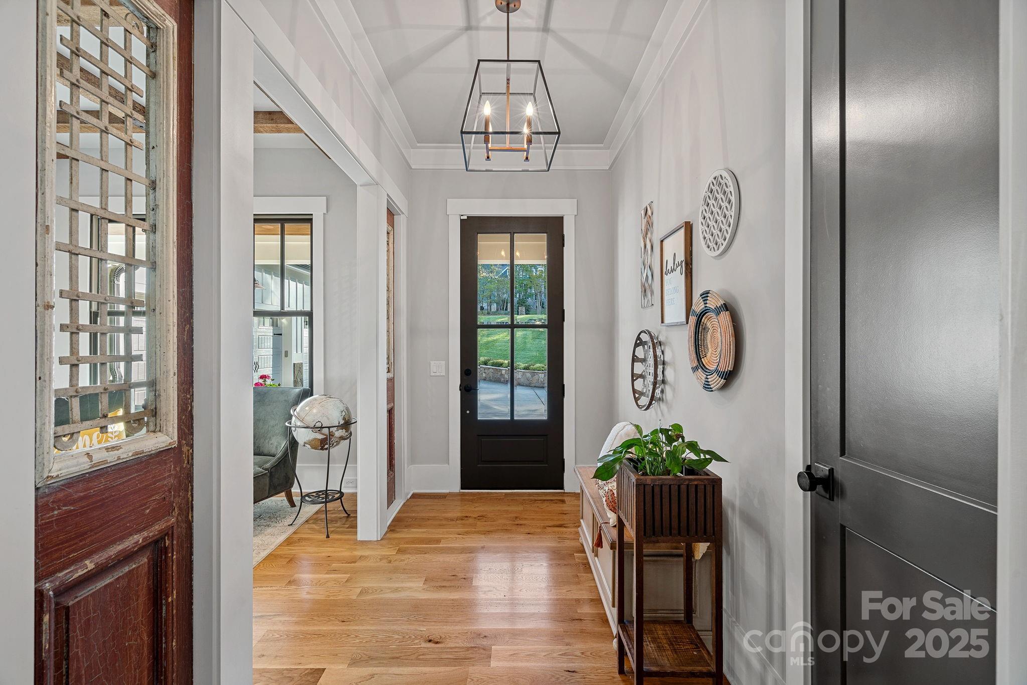 327 Kenway Loop Mooresville, NC 28117 - Photo 4 of 46 a view of entryway with wooden floor