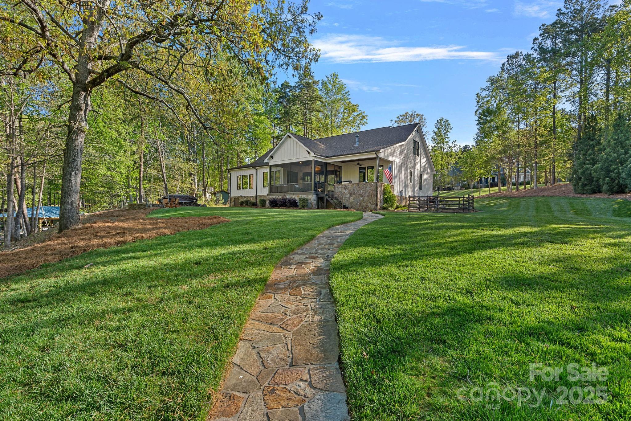 327 Kenway Loop Mooresville, NC 28117 - Photo 43 of 46 a front view of a house with a yard