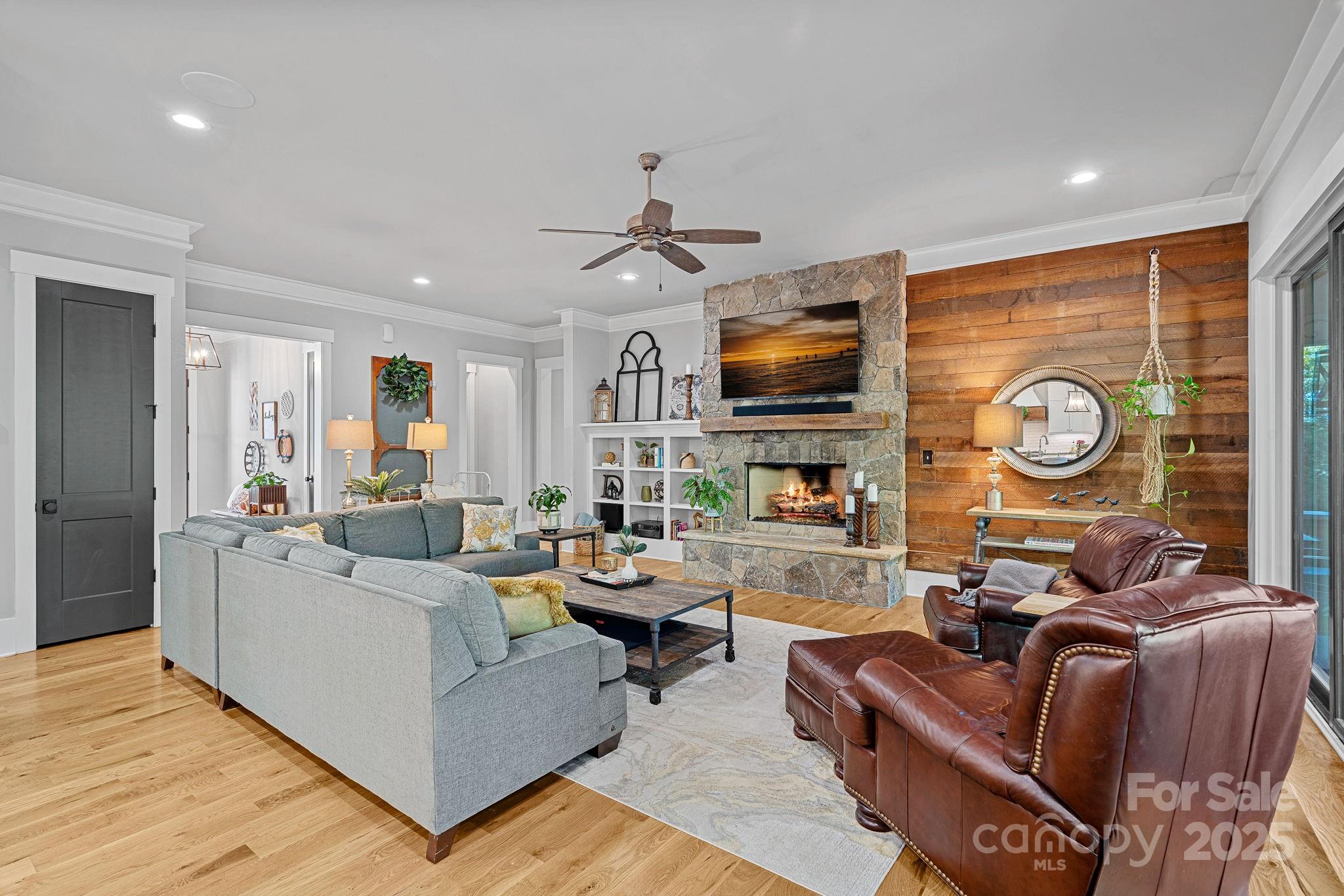 327 Kenway Loop Mooresville, NC 28117 - Photo 8 of 46 a living room with fireplace furniture and a flat screen tv