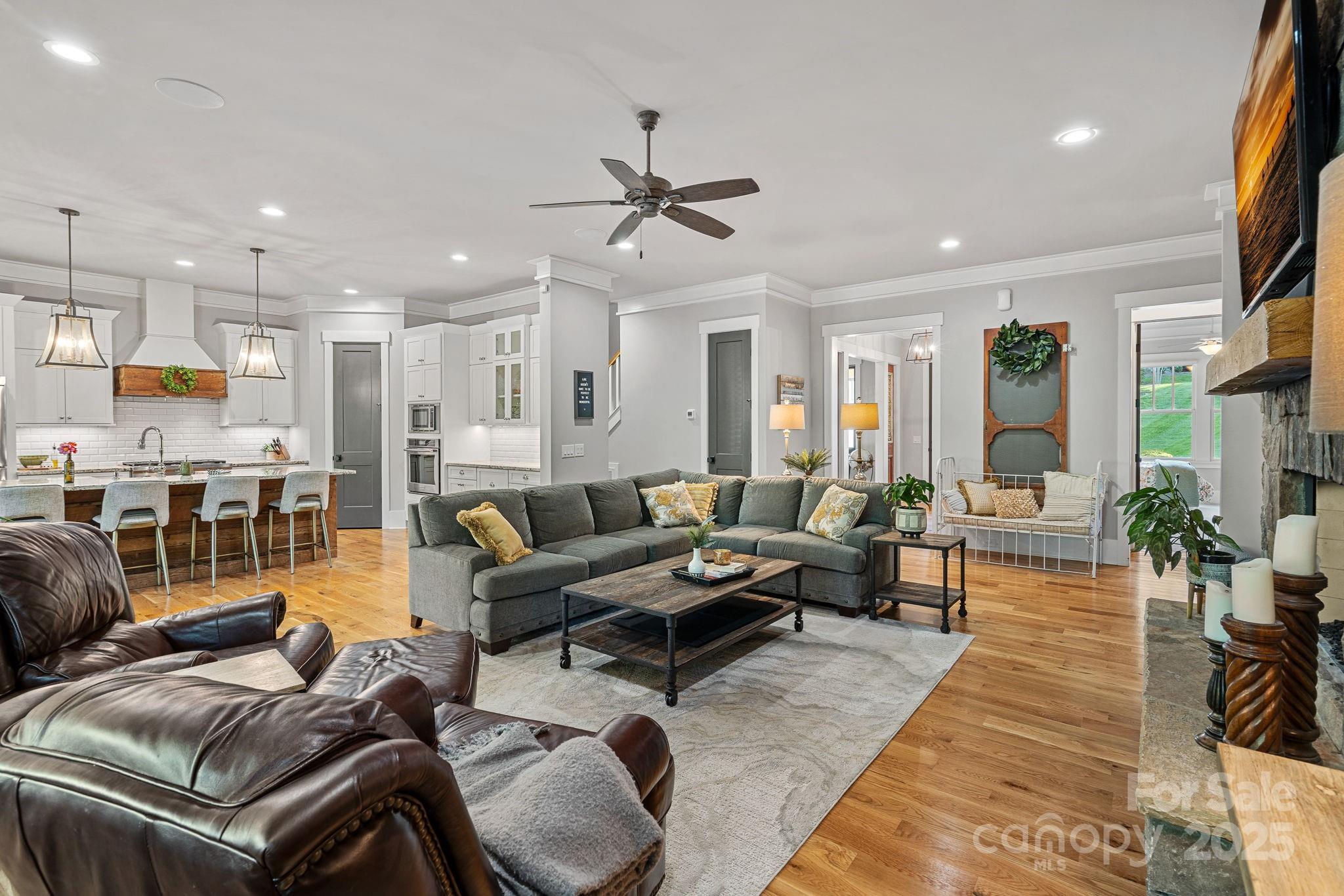 327 Kenway Loop Mooresville, NC 28117 - Photo 9 of 46 a living room with furniture kitchen view and a chandelier