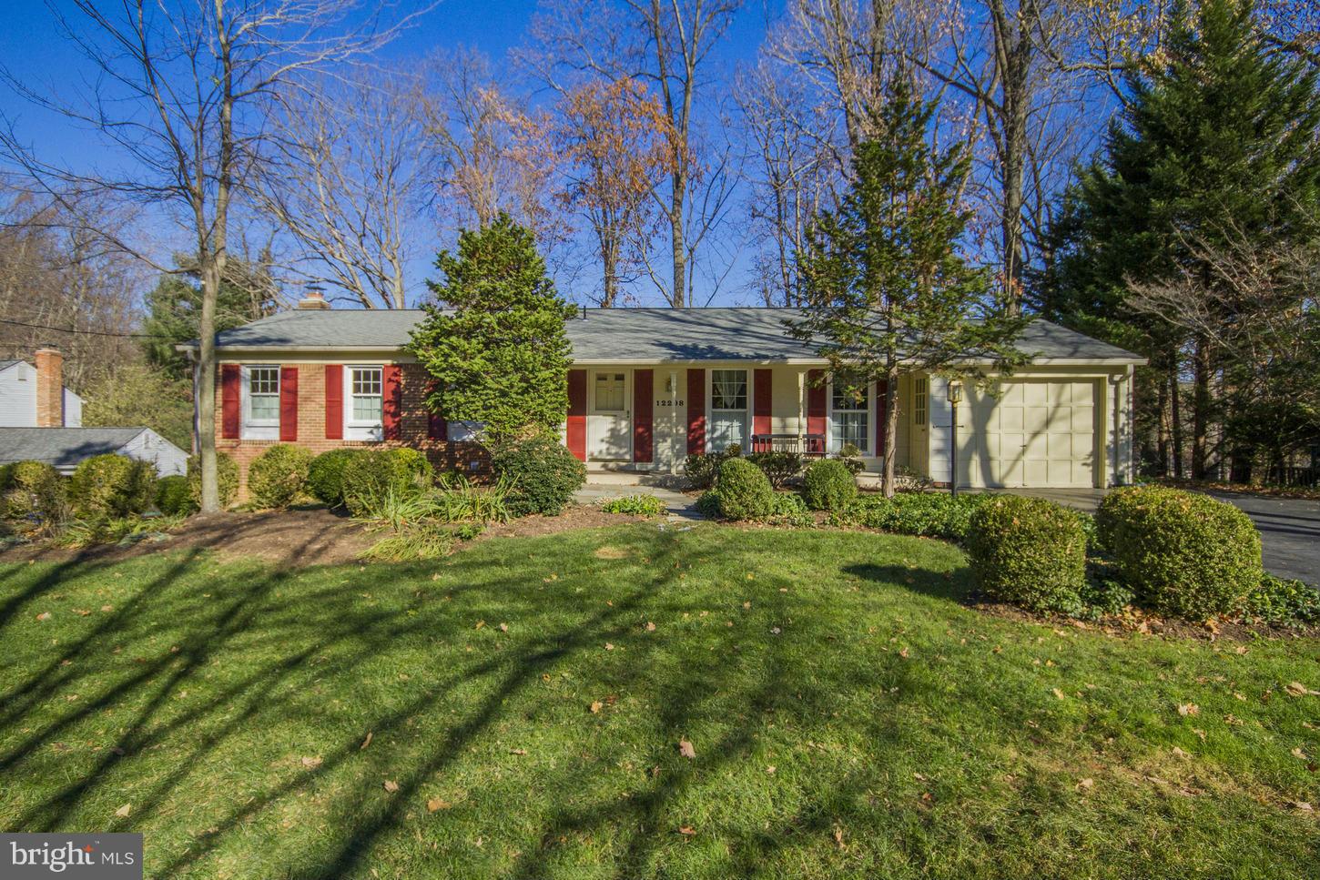 a front view of house with a garden