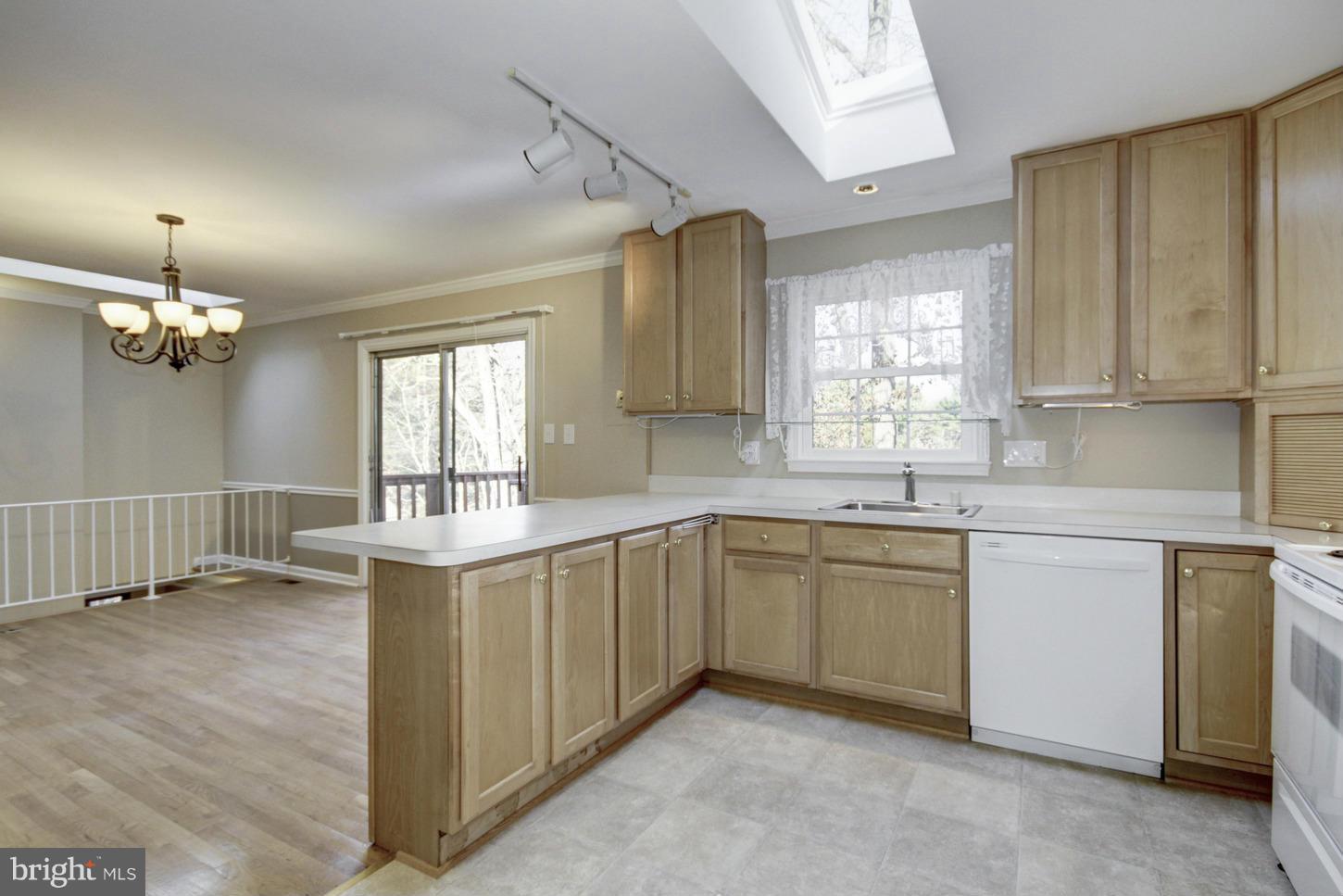 12208 St James Road Potomac, MD 20854 - Photo 11 of 29 a kitchen with a sink cabinets and window