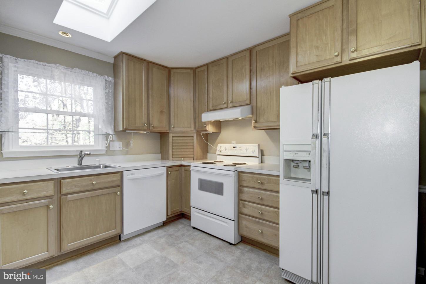 12208 St James Road Potomac, MD 20854 - Photo 12 of 29 a kitchen with stainless steel appliances granite countertop a refrigerator sink and cabinets