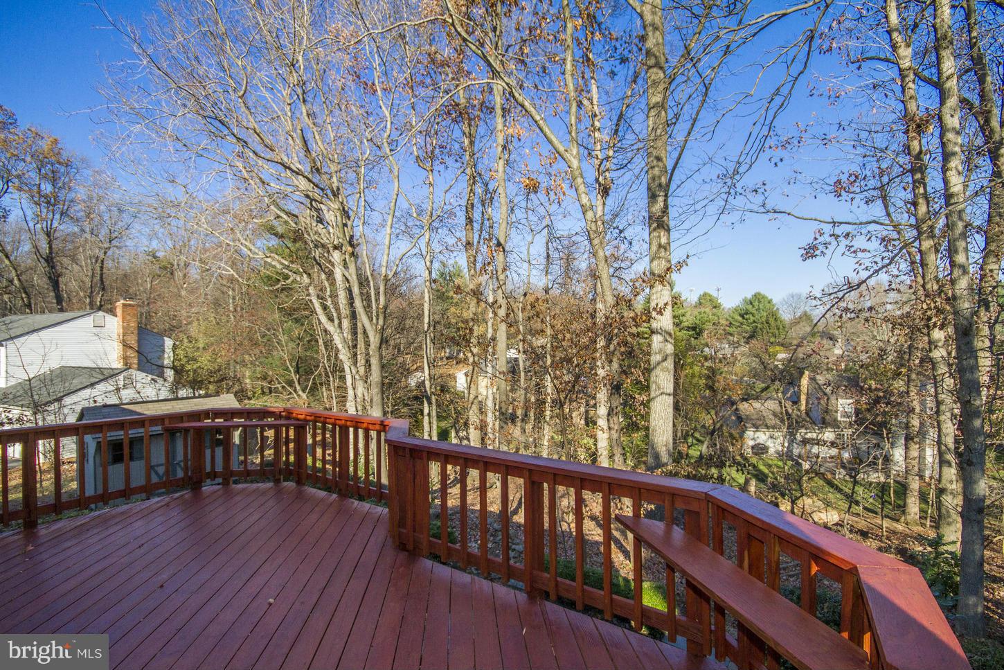 12208 St James Road Potomac, MD 20854 - Photo 25 of 29 a view of a balcony with wooden floor and fence