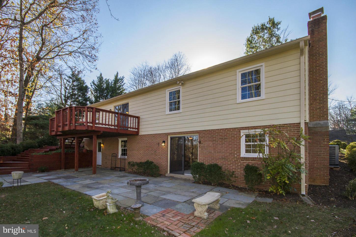 12208 St James Road Potomac, MD 20854 - Photo 29 of 29 a front view of a house with garden