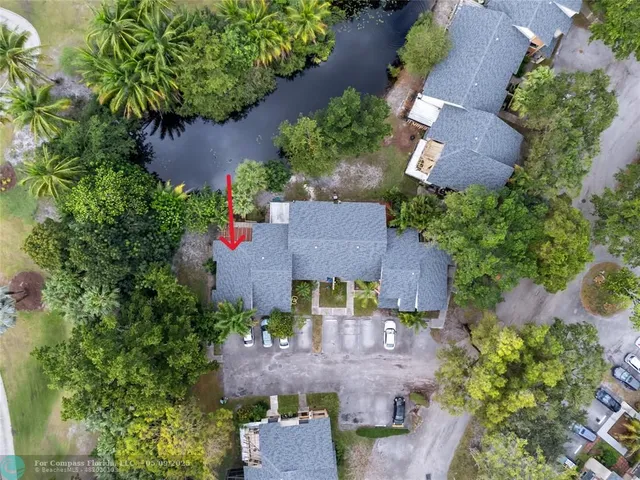 an aerial view of residential house with outdoor space and lake view