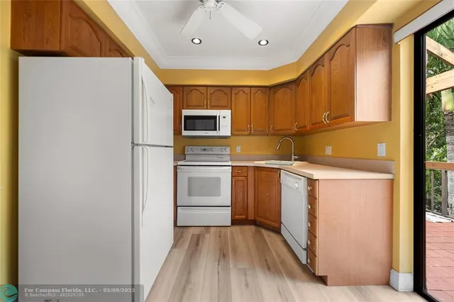 a kitchen with appliances and cabinets
