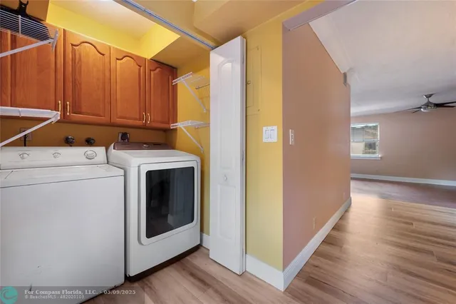 a view of a storage & utility room with washer and dryer