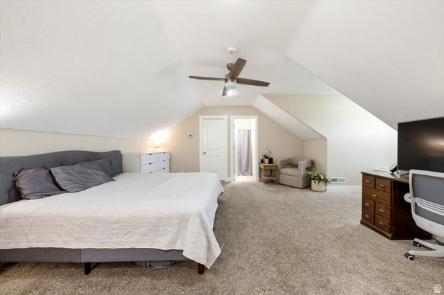 621 East 940 South St. George, UT 84790 - Photo 42 of 55 Carpeted room featuring a sloped ceiling and white walls