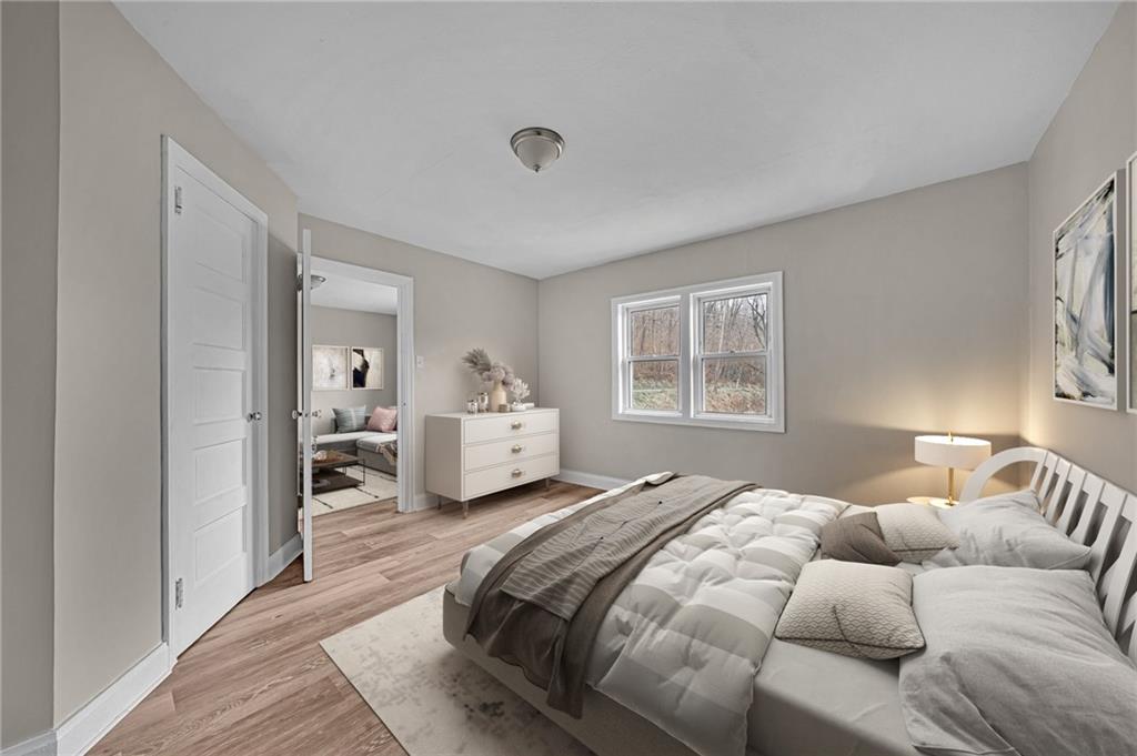 980 Crucible Road Rices Landing, PA 15357 - Photo 13 of 24 a bedroom with a bed and a window