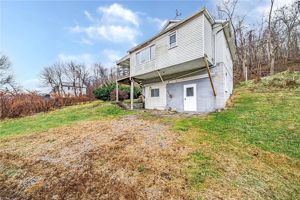 980 Crucible Road Rices Landing, PA 15357 - Photo 23 of 24 a view of a house with backyard and trees