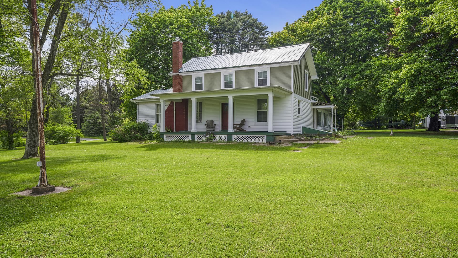 13524 White School Road Roscoe, IL 61073 - Photo 1 of 23 a front view of house with yard and green space