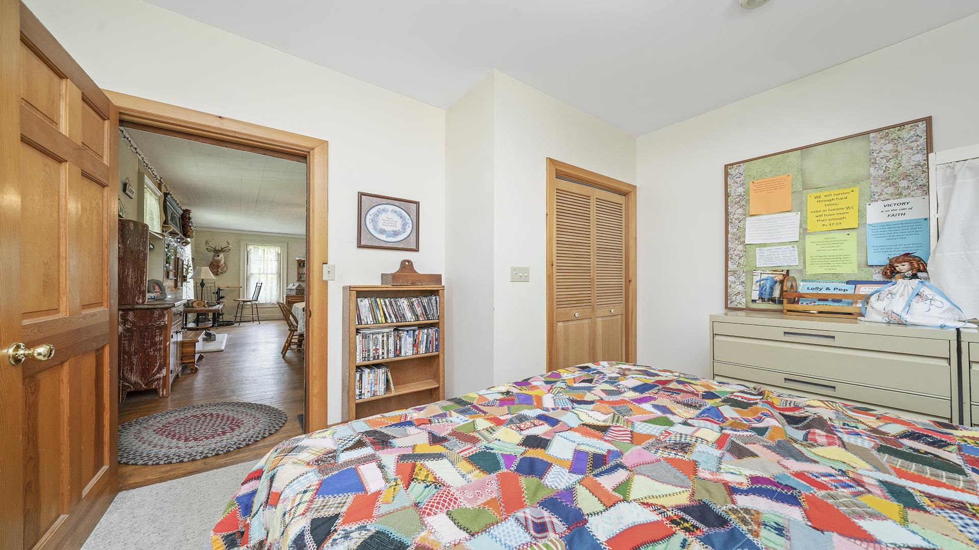 13524 White School Road Roscoe, IL 61073 - Photo 13 of 23 a bedroom with a bed and a dresser