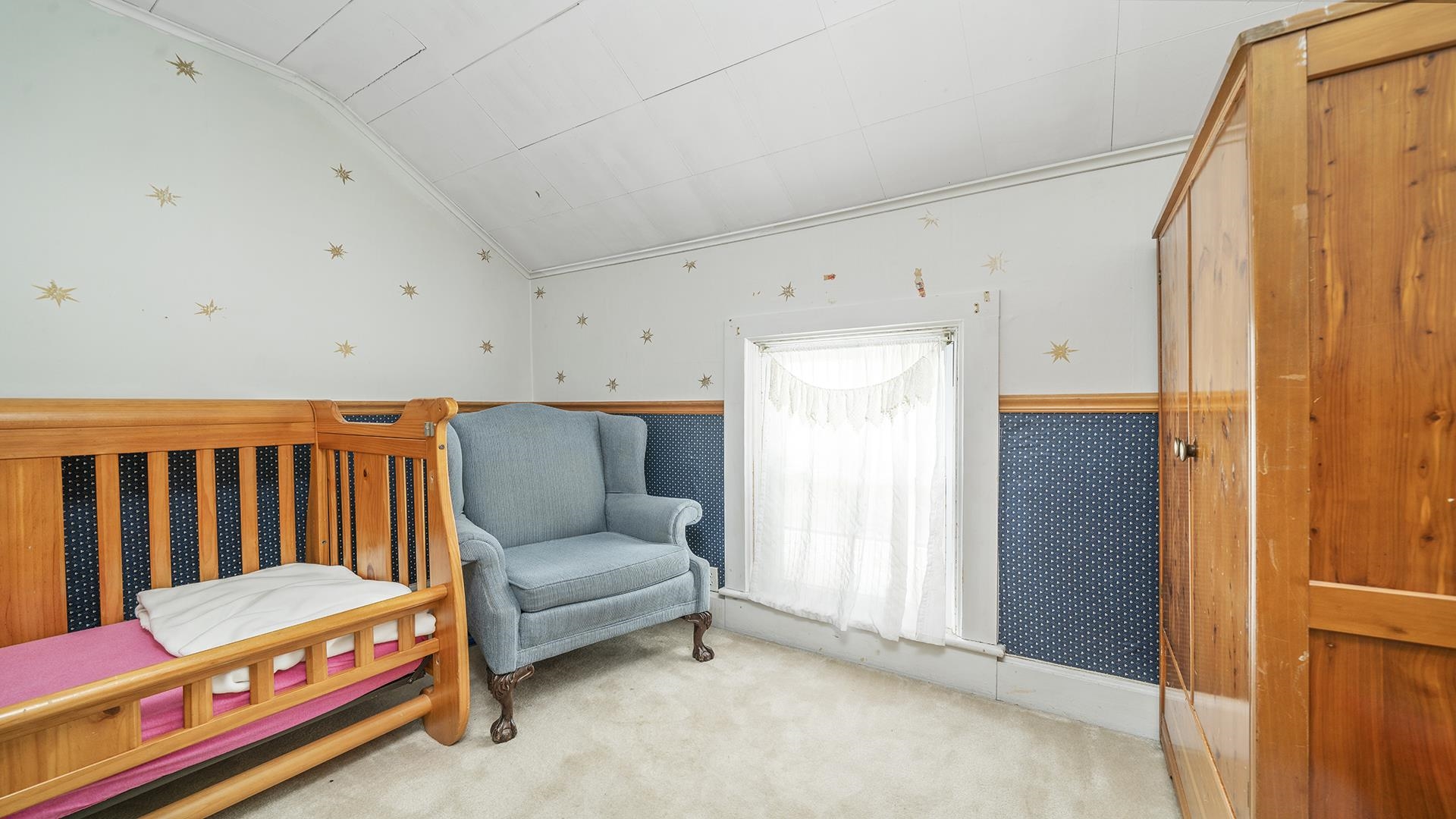 13524 White School Road Roscoe, IL 61073 - Photo 17 of 23 a living room with furniture and a baby crib