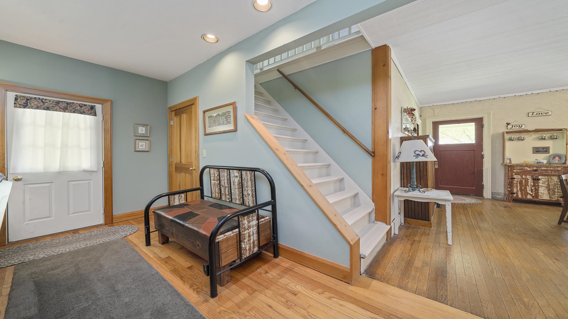 13524 White School Road Roscoe, IL 61073 - Photo 6 of 23 a living room with furniture and a wooden floor