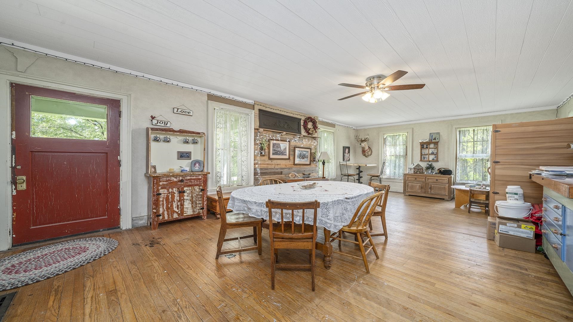 13524 White School Road Roscoe, IL 61073 - Photo 7 of 23 a dining room with furniture and wooden floor