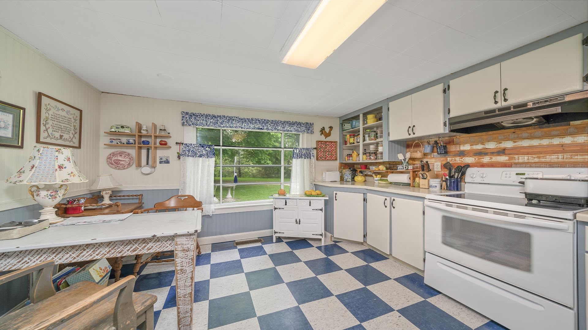 13524 White School Road Roscoe, IL 61073 - Photo 10 of 23 a kitchen with stainless steel appliances and cabinets