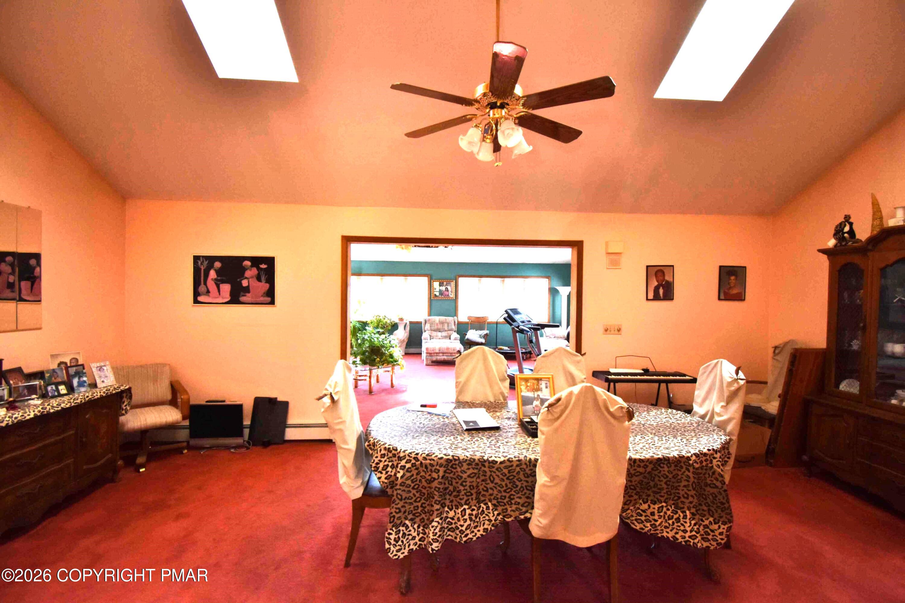 160 Quiet Valley Road Mount Bethel, PA 18343 - Photo 16 of 44 a dining room with furniture and a flat screen tv